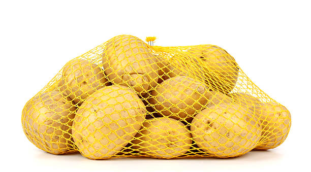 istock potatoes in a pack isolated on white background 468979584