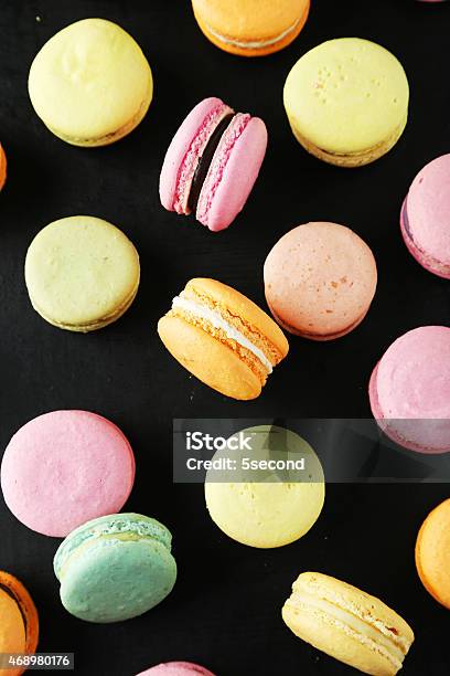 French Colorful Macarons On Black Background Stock Photo - Download Image Now - 2015, Backgrounds, Baked Pastry Item
