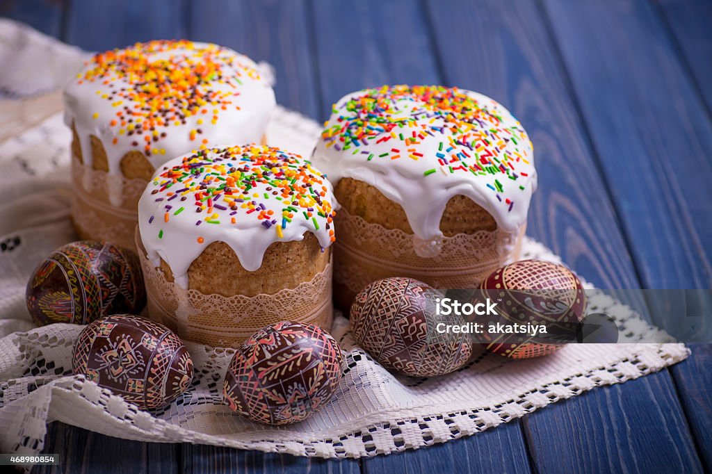 traditional easter cake kulich Ukrainian Russian with colored eggs traditional easter cake kulich Ukrainian Russian with colored eggs on blue wooden background 2015 Stock Photo