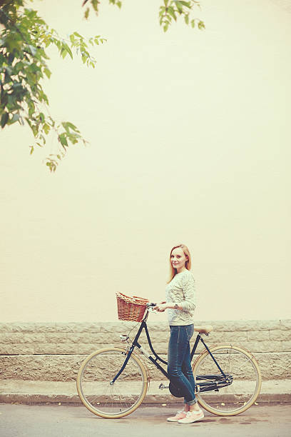 istock Young blonde woman on a vintage bicycle 468981704