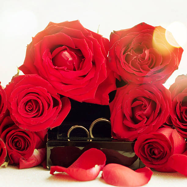 istock Wedding rings with red roses 468983900