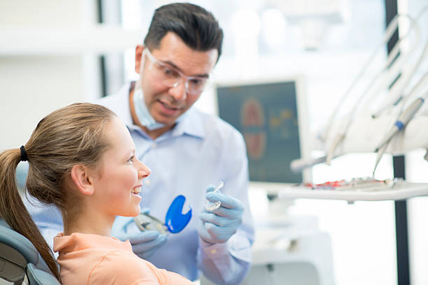 young female teenager getting invisalign
