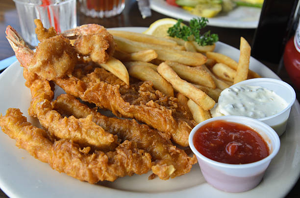 istock Fried battered seafood with freuch fries and dipping sauce 468984517