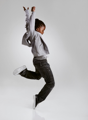A young boy hip-hop dancing in the studio