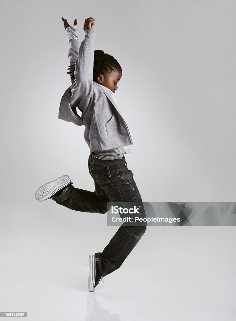 Working on his hip hop routine A young boy hip-hop dancing in the studio Child Stock Photo