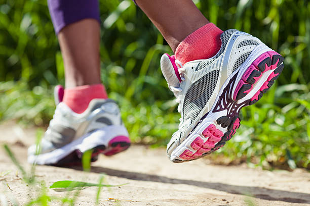istock Walking/running legs sport shoes. 468988326