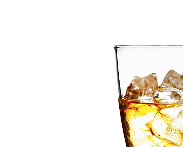 istock Glass of scotch whiskey and ice on a white background 468988962