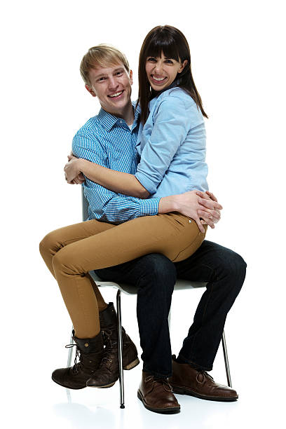 istock Cheerful couple sitting on chair 468991375