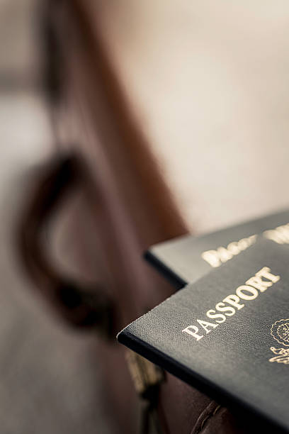 istock Old Fashioned Suitcase on a Bed with Passports 468992193