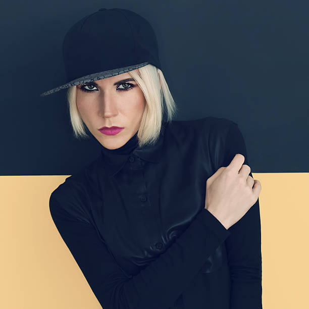 istock Stylish blonde in black cap and black shirt. 468992620