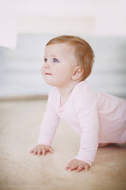 istock Baby princess crawling on the floor 468992737