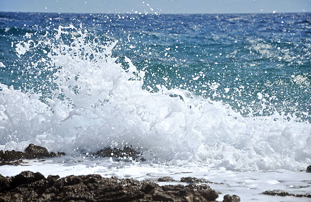 istock Rocky coast with splashing waves 468992778