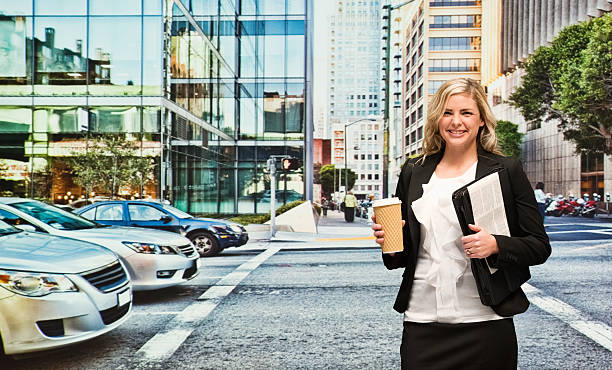 istock Smiling businesswoman holding coffee cup 468993962