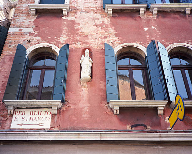Venezia, Italy - October 3, 2013: street name signs and tourist directions are traditionally printed on typical fonts and large size (\
