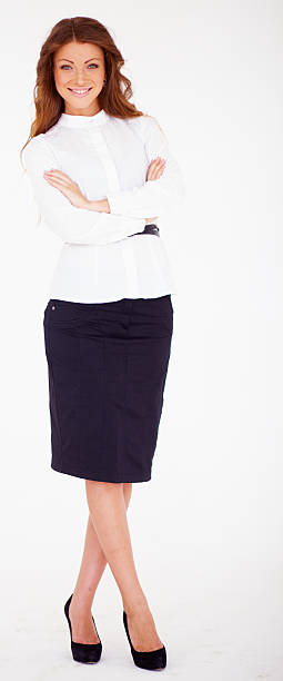 istock Confident young business lady standing with folded hand 468994141