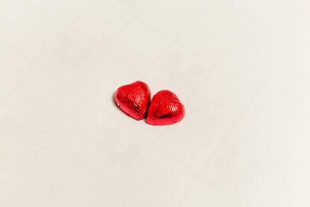 Two heart-shaped chocolate praline stock photo