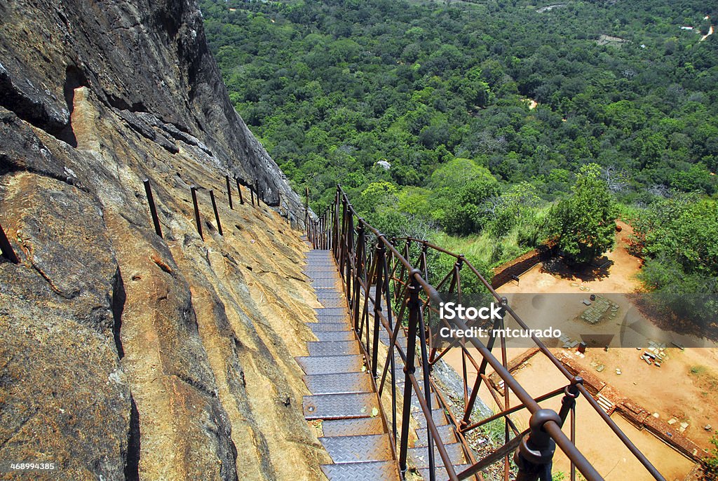 Sigiriya lion rock fortress,Sri Lanka Sigiriya, Matale District, Central Province, Sri Lanka: famous Sigiriya lion rock fortress - metal stairs on the cliff face with the forest below - photo by M.Torres Ancient Stock Photo