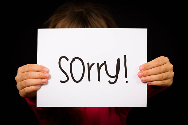 istock Child holding Sorry sign 468996696