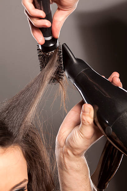 istock hairdresser doing hair 468999700