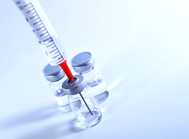 istock Syringe and vial with copy space 469000296