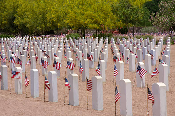 istock Memorial Day - Cemetery with USA Flags 469002250