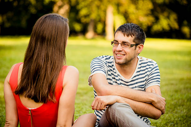 istock Young couple talking on date 469002344
