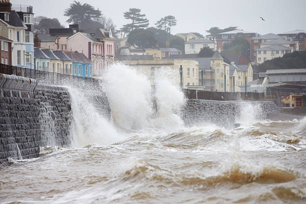 istock Large Waves Breaking Against Sea Wall At Dawlish In Devon 469002346