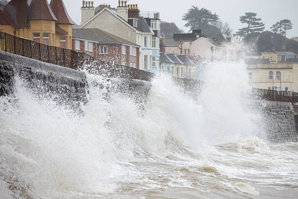 istock Large Waves Breaking Against Sea Wall At Dawlish In Devon 469002348