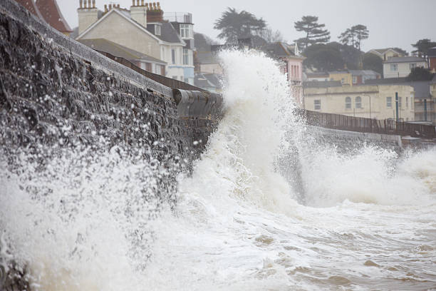 istock Large Waves Breaking Against Sea Wall At Dawlish In Devon 469002434