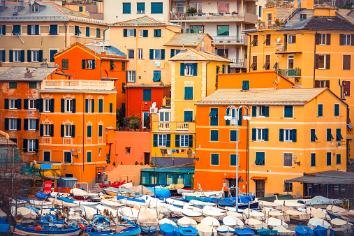 Beautiful bright buildings and sail boats in Italy