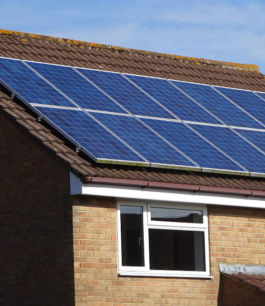 istock Image of modern house with solar panel cells on roof 469003430