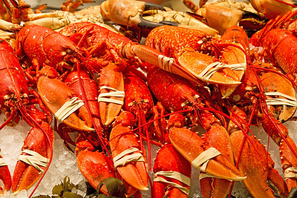 istock Whole red lobsters on a market 469005067