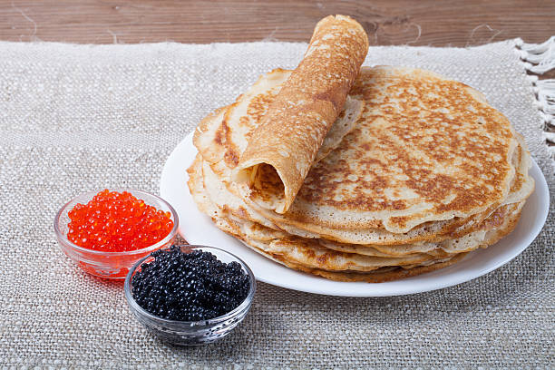 istock Russian pancakes - blini with red and black caviar 469005914