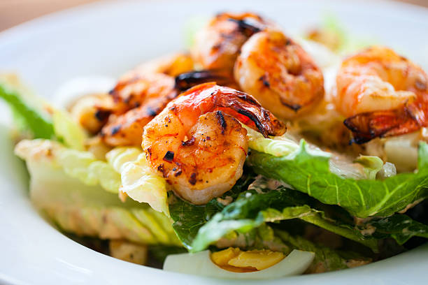 Shrimp salad Grilled shrimps and fresh green salad served for lunch lettuce photos stock pictures, royalty-free photos & images