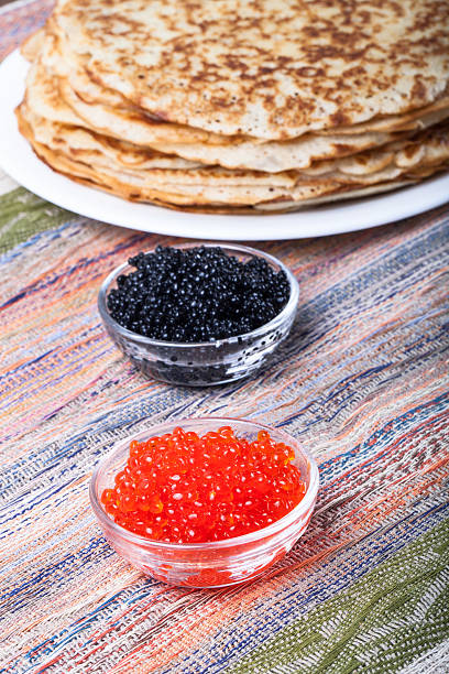 istock Russian pancakes - blini with red and black caviar 469007096