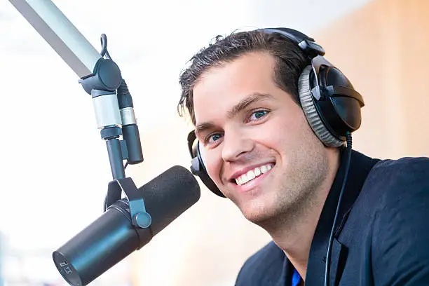 Presenter or host in radio station hosting show for radio live in Studio