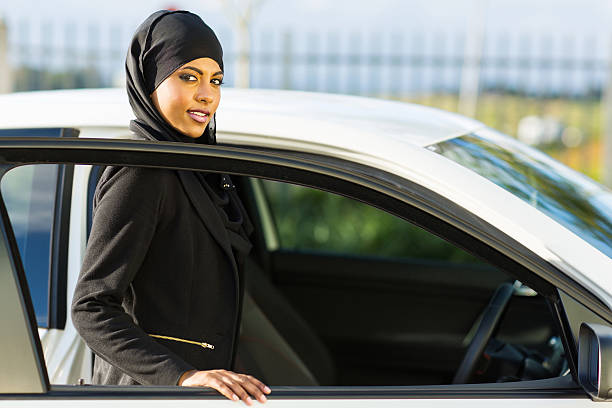 istock arabian girl getting in a car 469012561