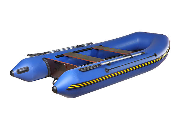 istock Blue rubber inflatable boat PVC with oars, isolated on white. 469017833