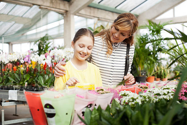 istock Mother and daughter at garden store 469019672