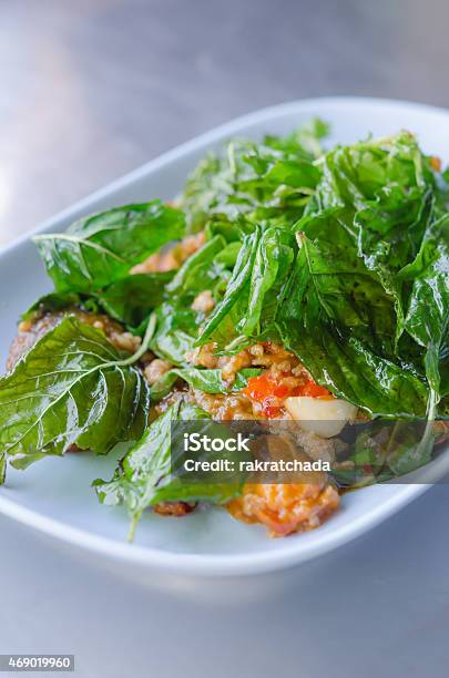 Stir Fried Pickled Eggs With Crispy Basil Stock Photo - Download Image Now - 2015, Basil, Chili Pepper