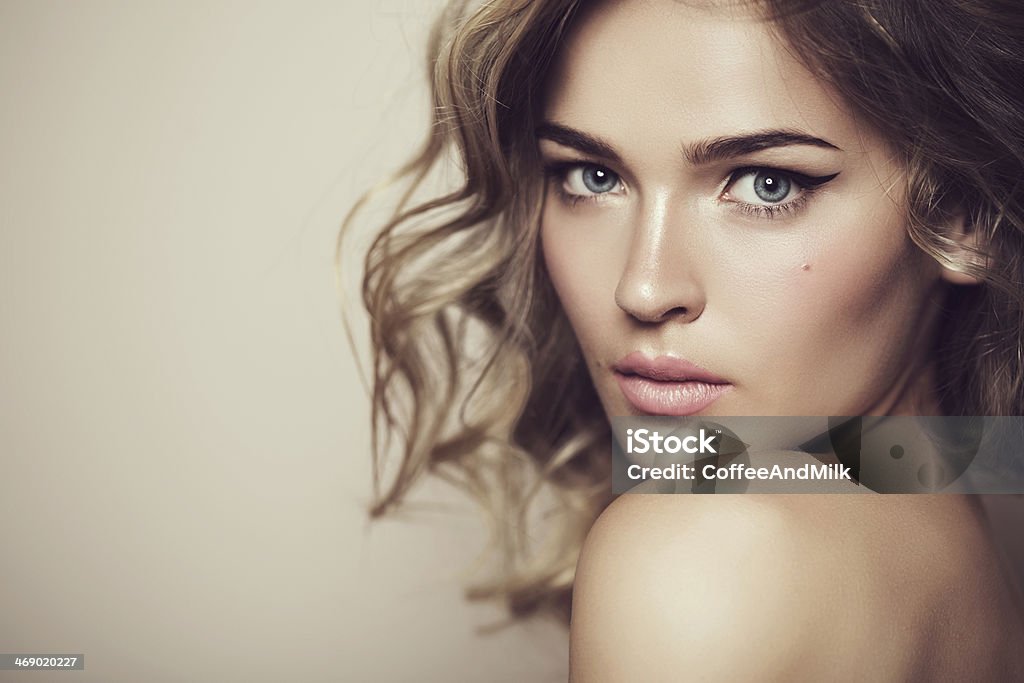 Beautiful woman with professional makeup and hair Beautiful woman with make up Blond Hair Stock Photo