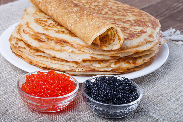 istock Russian pancakes - blini with red and black caviar 469024060
