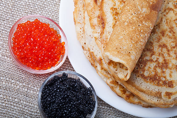 istock Russian pancakes - blini with red and black caviar 469024066