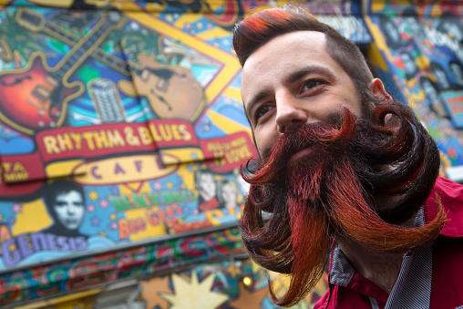 Moscow, Russia, April 04,2015: Participant of the third All-Russian championship of beards and mustaches stays in public place at the central Moscow street on 04 of April 2015, Russia