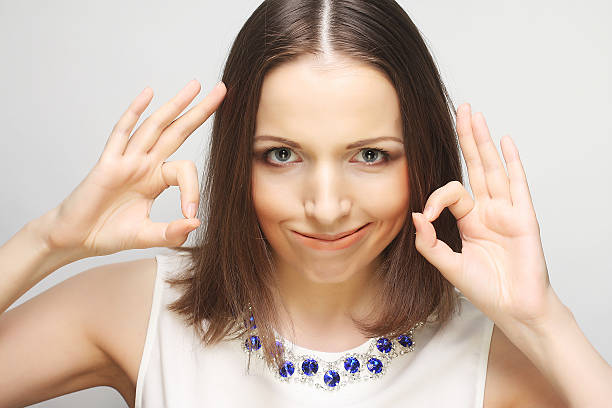 istock Successful girl gives thumb up with two hands 469024726