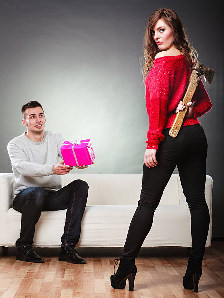 istock Trusting guy giving present to misleading girl 469025784