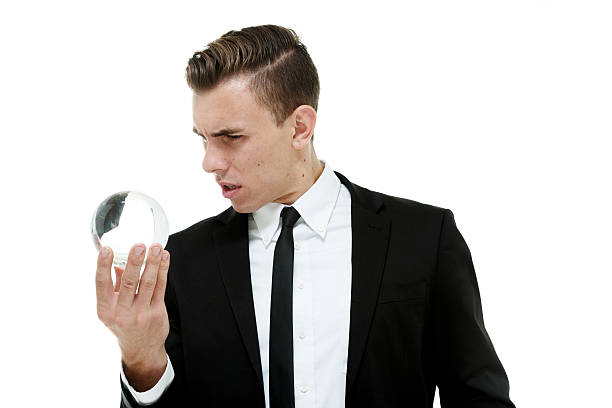 istock Businessman looking into crystal ball 469026570
