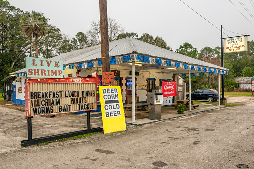 Otter Creek, Florida, USA - January 15, 2015 : Vintage gas pump and a general store on US Highway 19, near Cedar Key, Florida