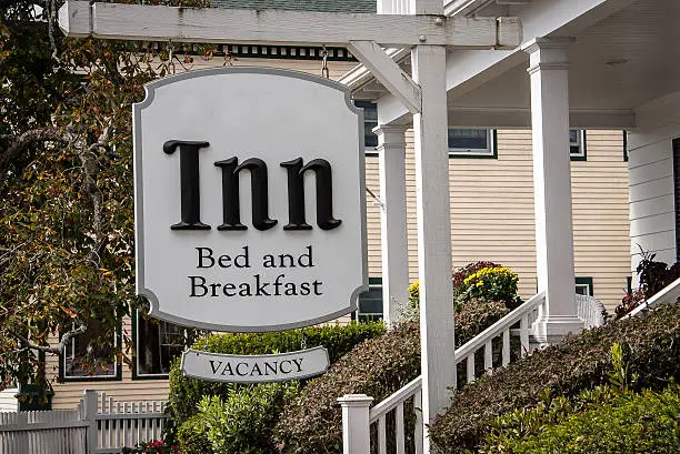 White sign for a bed and breakfast with vacancy