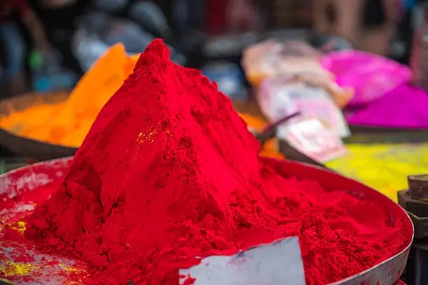 Red, orange, yellow and pink color pigment powders, seen in a Jaipur market, which are sold in preparation of the Indian Holi festival also called Festival of colors.